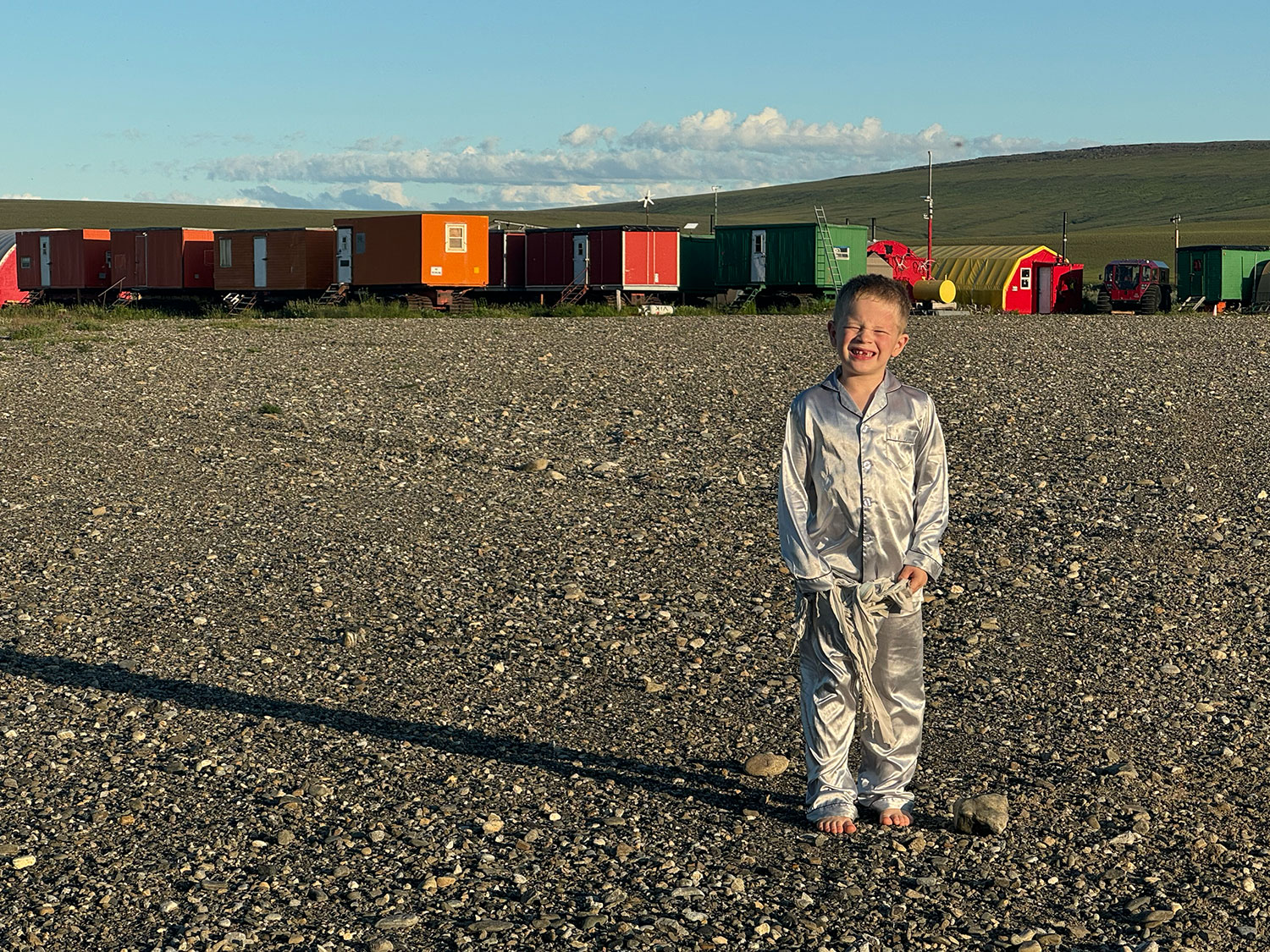 Knox Neumayr in front of the camp at Kavik in the middle of the night